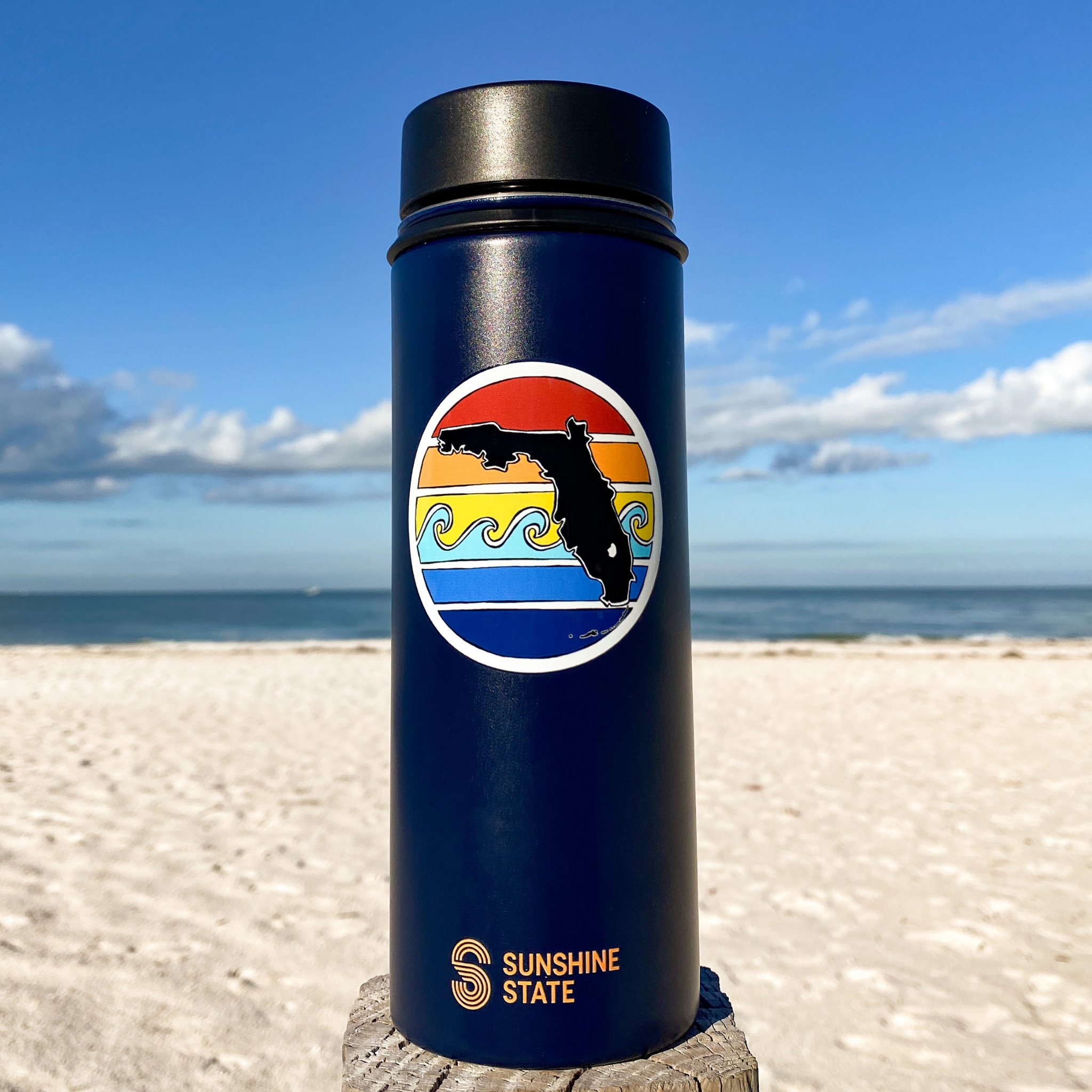 https://sunshinestategoods.com/cdn/shop/products/Florida-Sunset-Water-Bottle-Navy.png?v=1702600234